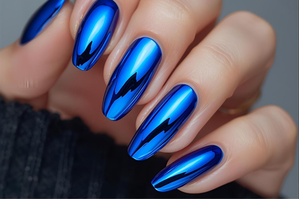 blue chrome metallic nail polish on a neutral background Salon ready manicure Fake extensions Presson sticky artificial nails from happyhands8