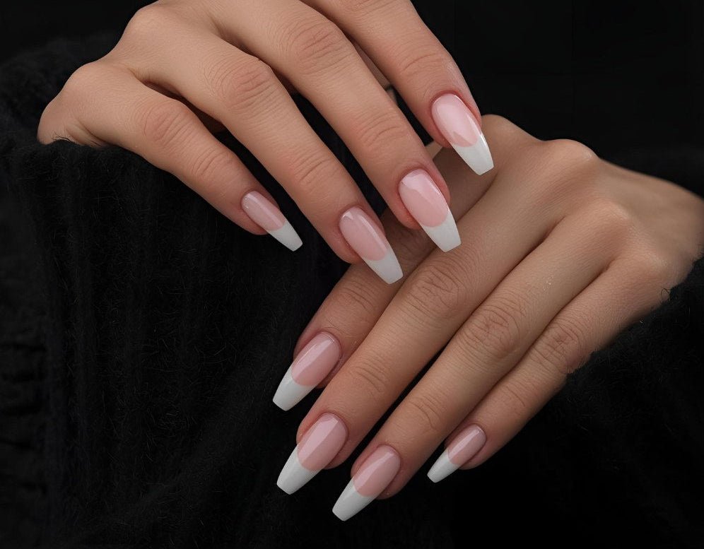 Close-up of hands with pink and white nail polish on a black background Salon ready manicure Fake extensions Presson sticky artificial nails from happyhands8