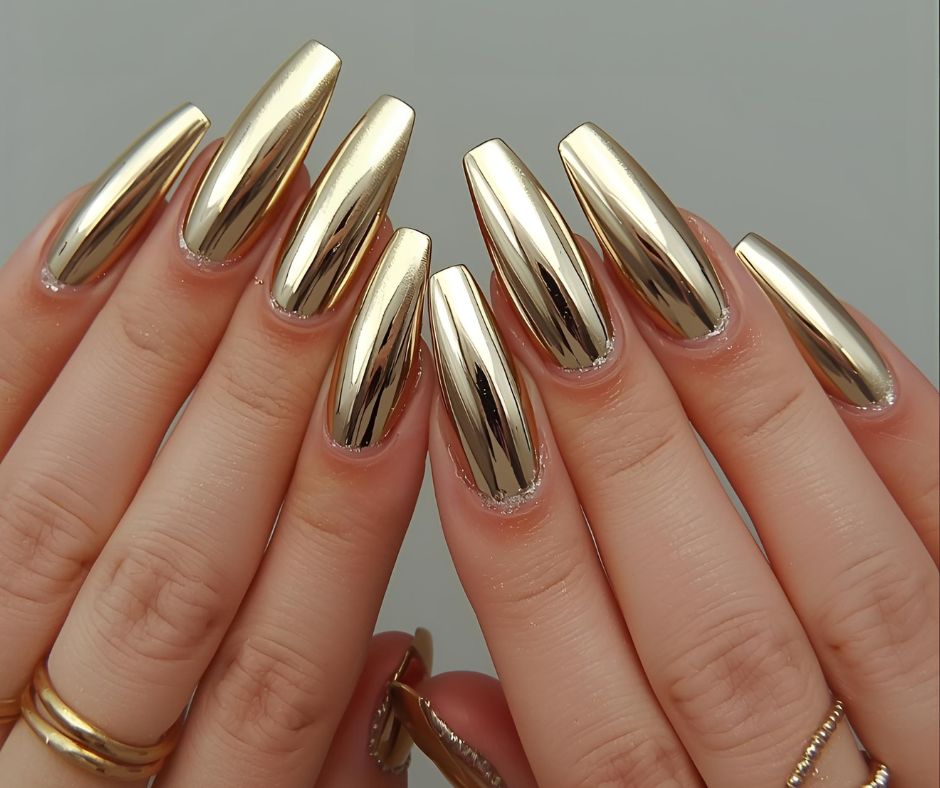 Gold nail polish on a neutral background