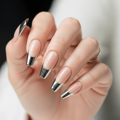 Hand with pink and silver fake nails on a blurred background