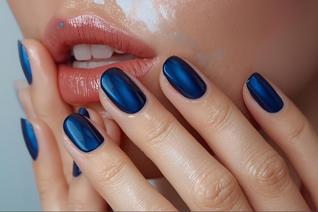 Salon ready manicure Fake extensions Presson sticky artificial nails from happyhands8  Close-up of hands with blue nail polish and red lipstick.